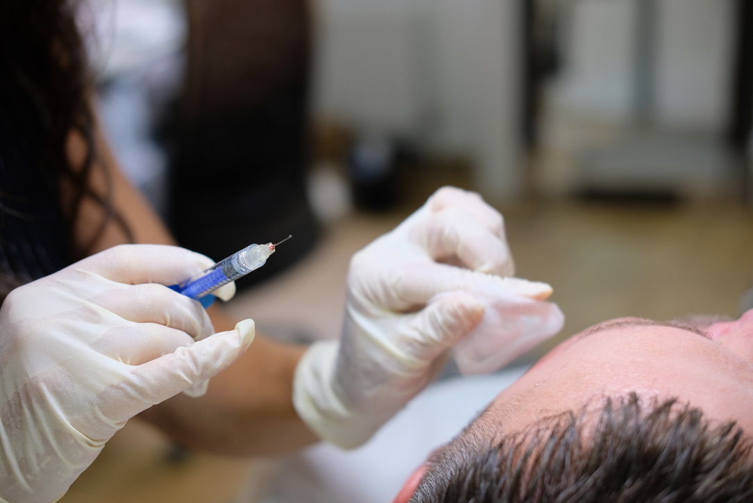 Close-up of precise injection technique during aesthetic treatment